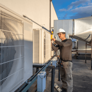 HVAC technician servicing mini-split air conditioners