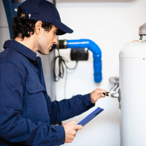 Technician Repairing a Hot Water Heater