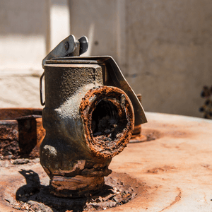 old rusted water heater pipe causing rusty water